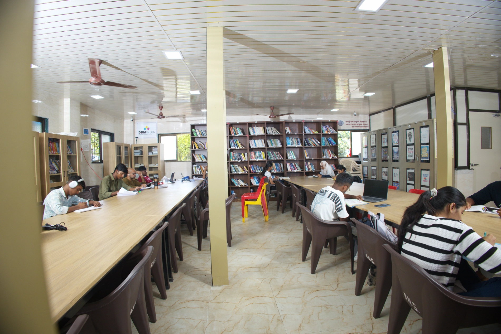 Wide view of students studying at the Empower Library